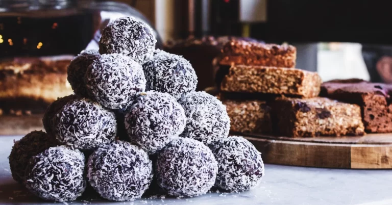 Gourmet Chocolate Coconut Bliss Balls: A Delectable Treat Blending Rich Cocoa, Butter, and Coconut Flakes, Perfectly Chilled for Indulgence.