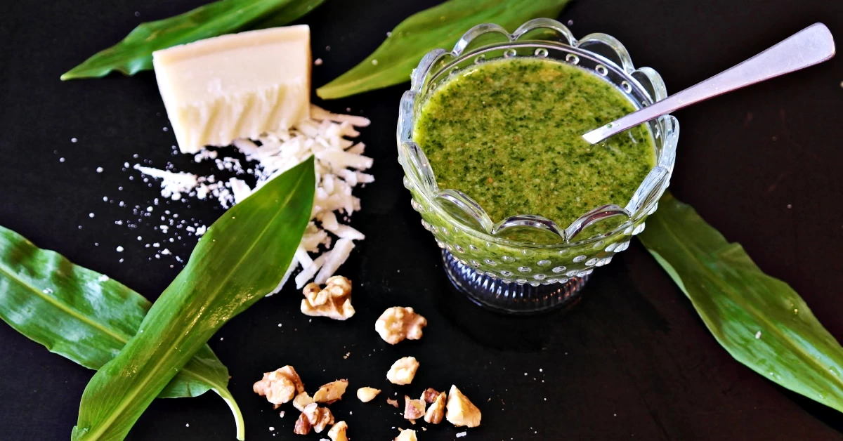 Savor the Simplicity of Homemade Pesto: Fresh Basil, Grated Parmesan, Toasted Pine Nuts, Garlic, and Olive Oil Perfectly Blended.