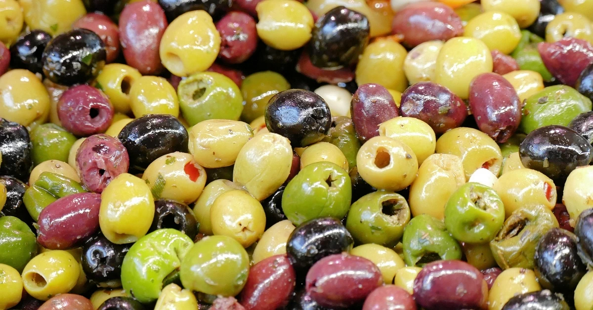 Delight in the Simplicity of a Super Easy Olive Salad in a Jar - Bursting With Flavors and Ready for Versatile Pairings.