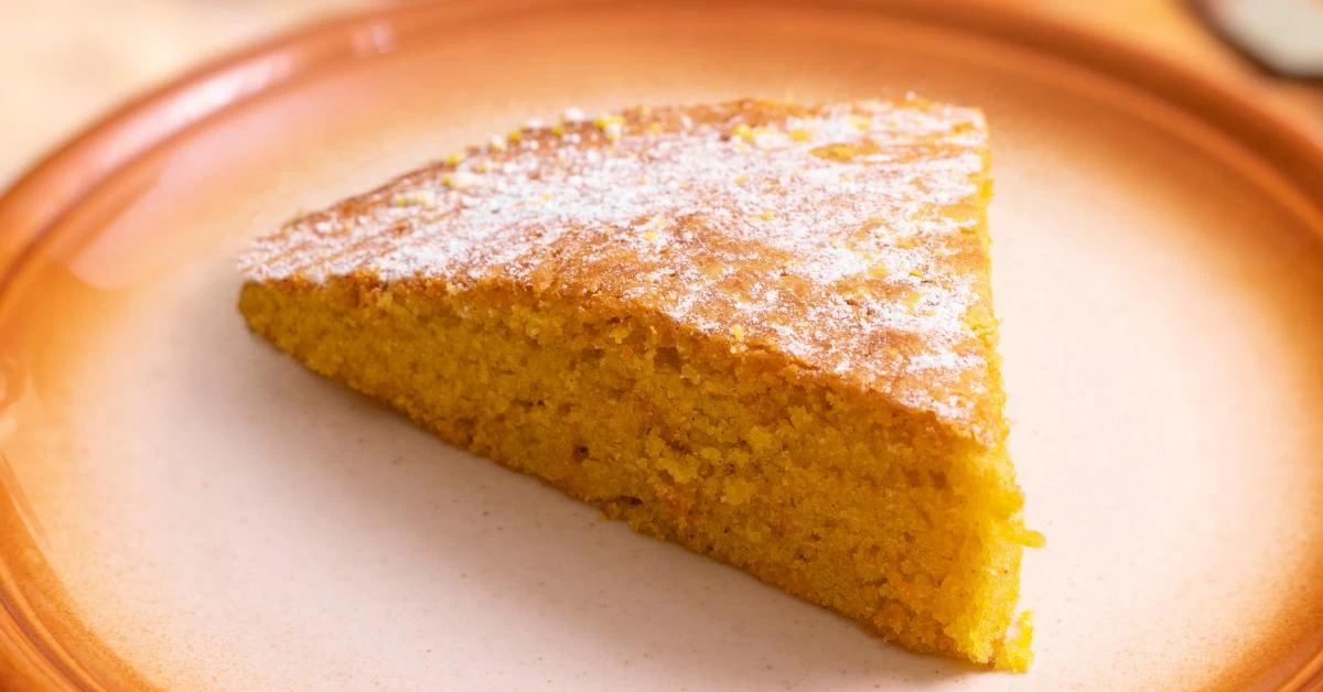 Delectable Sweet Corn Cake, Golden Perfection Adorned With Powdered Sugar. A Delightful Treat for Any Occasion. Enjoy the Sweetness.
